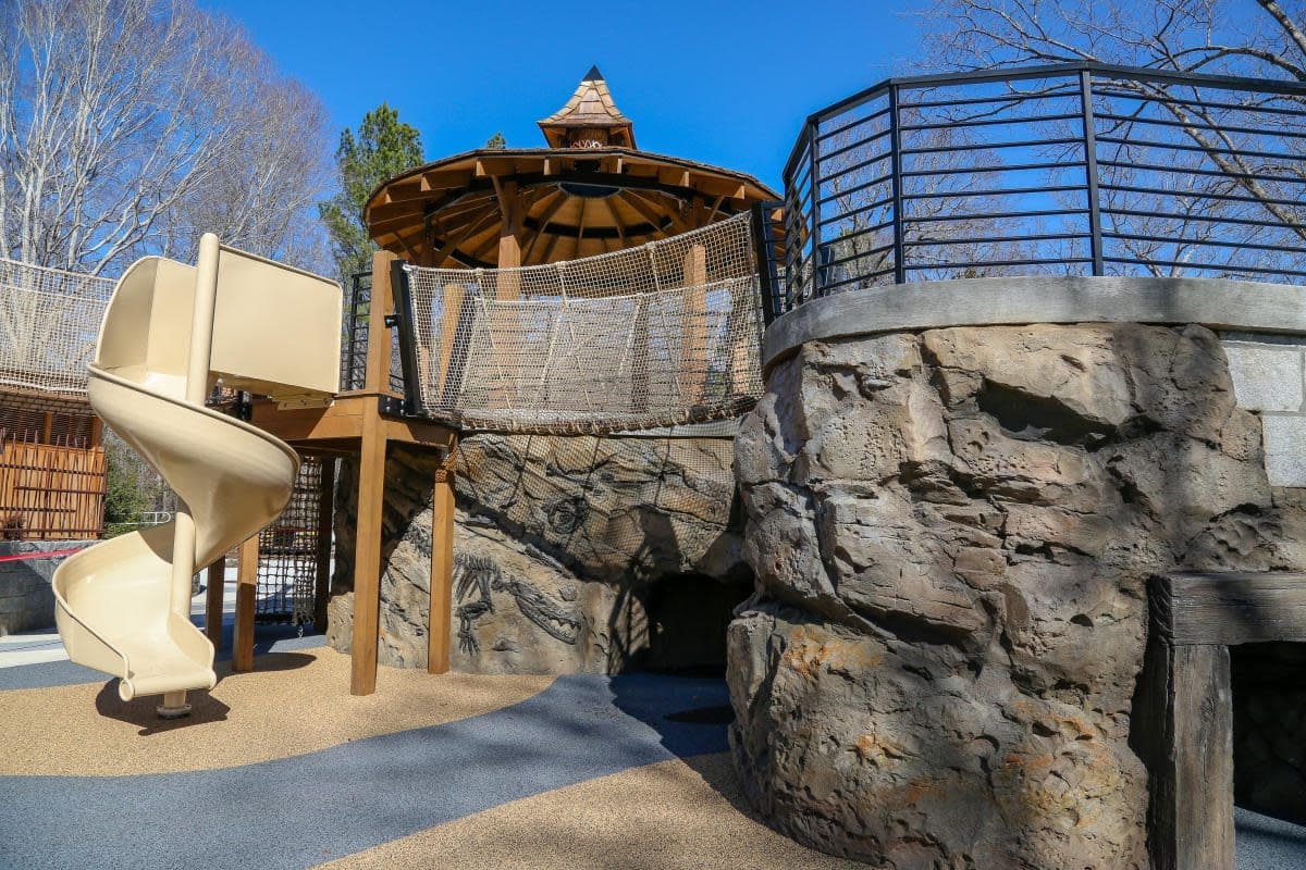 childrens garden sbg A large rock wall with a gazebo and stairs.