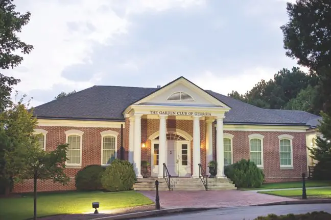 A large brick building with columns and pillars.