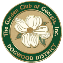 A green and white logo with flowers on it.