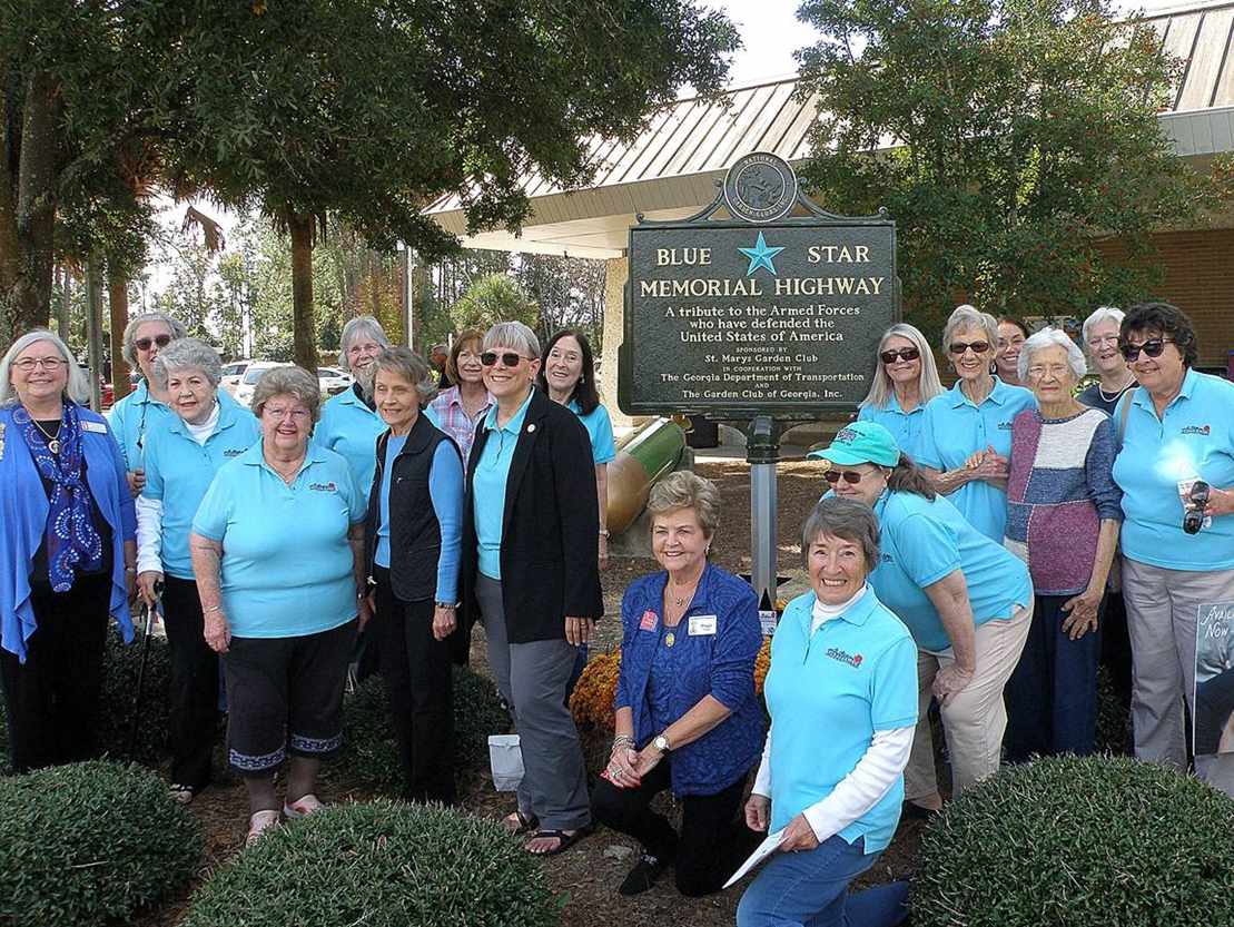 blue-star-oleander-camden-112021 A group of people posing together for a picture