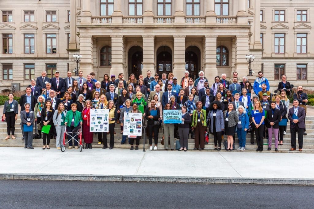 A group of people standing in front of a building.