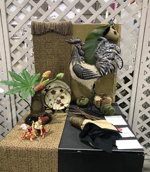 A chair with a bird statue on it