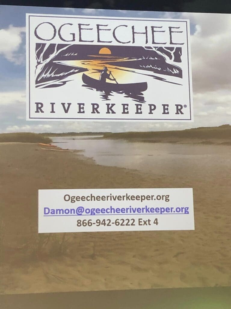A picture of the ocean and sky with an ogeechee riverkeeper logo.