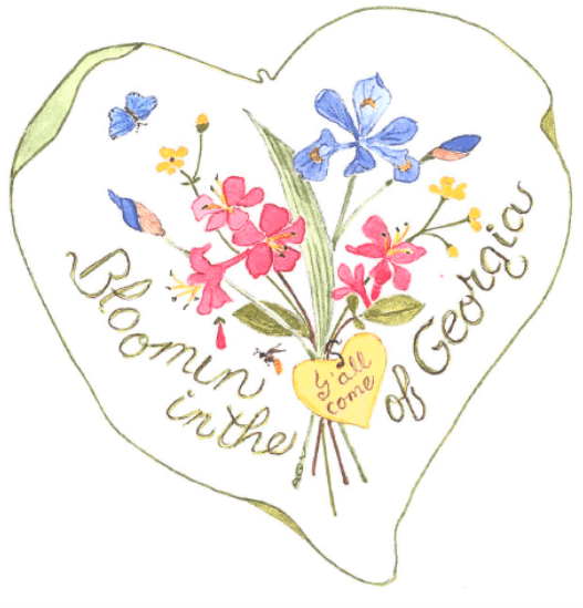 A heart shaped pillow with flowers on it.