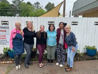 A group of women standing next to each other.