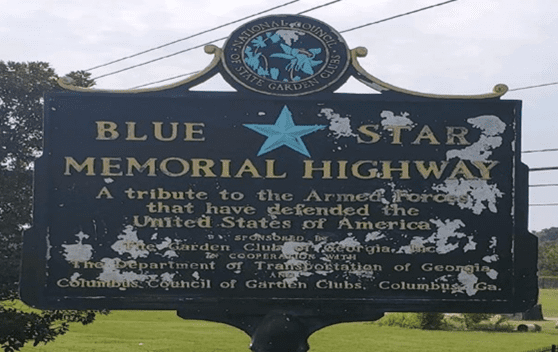 A sign that reads " blue star memorial highway ".