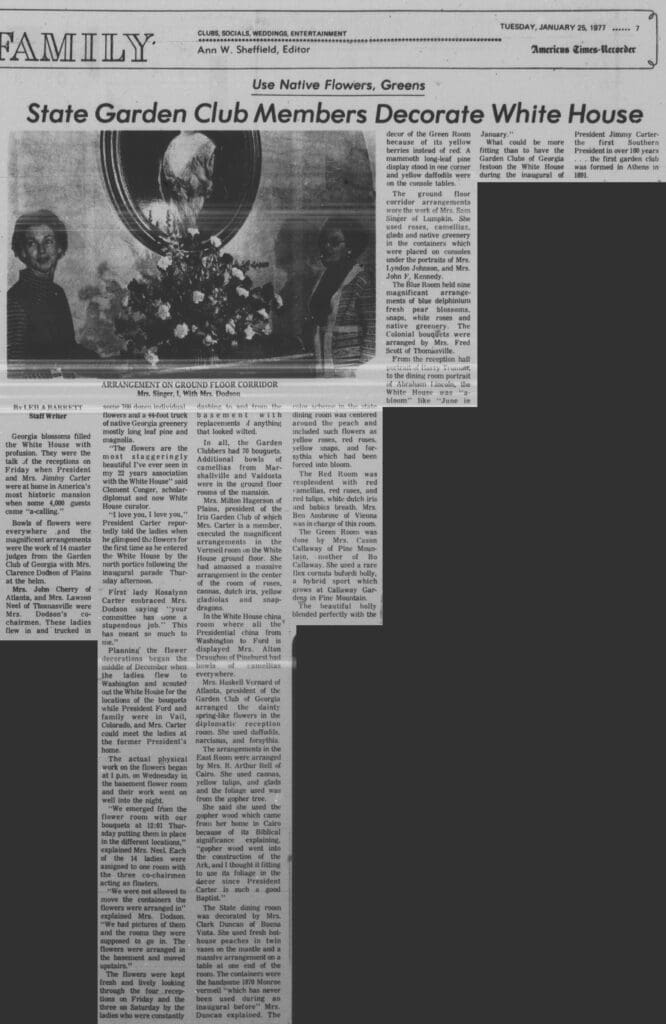 A newspaper article with an image of a woman and flowers.