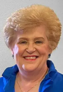 Melodie Smith Portrait of an elderly woman smiling.