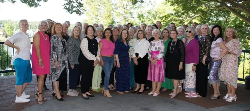 LaurelDistrictatGCGConv2025 A group of women posing outdoors in casual and semi-formal outfits.