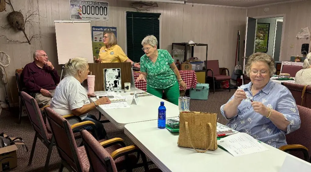 cwp getting started Terry Jones and Molly Kimler prepare district directors and CWP chairs for a fun morning. CWP chair Jean O'Shields assists Peggy Wililiams, and Bonnie Dudley gets busy.