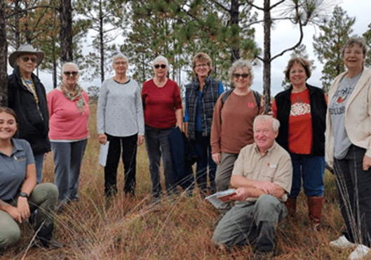 Butler-wildlife-mgt A group of people standing in the grass.